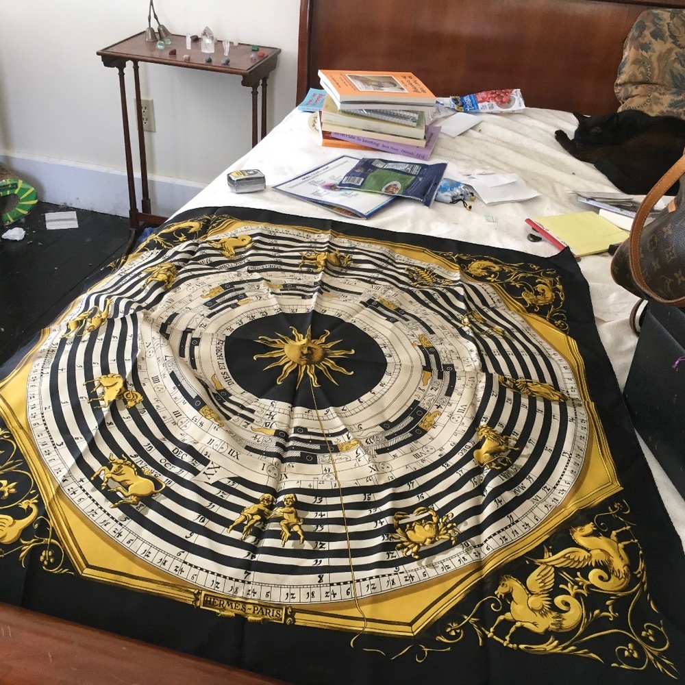 A black white and gold vintage Hermes zodiac scarf